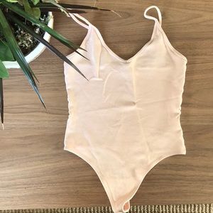 Blush pink bodysuit from Aritzia